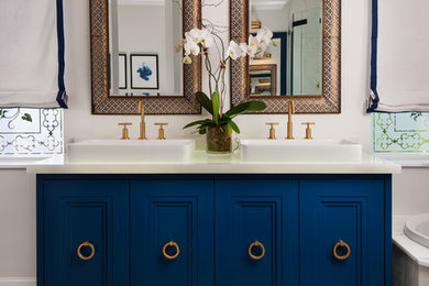 Example of a mid-sized transitional master white tile and stone tile marble floor bathroom design in Miami with a vessel sink, blue cabinets and recessed-panel cabinets