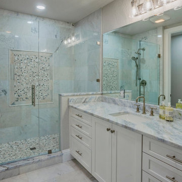 Refined Marble Bathroom with Sleek Contemporary Features Throughout the Space