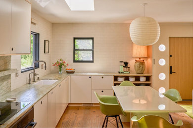 Example of a 1960s kitchen design in Los Angeles with green countertops