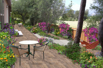 This is an example of a small traditional backyard patio in Santa Barbara with concrete pavers.