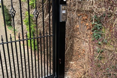Metal gate installation with a 2button GSM intercom for a shared driveway