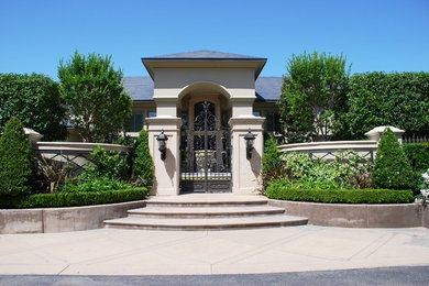 Inspiration for a huge traditional full sun front yard concrete paver landscaping in Other.