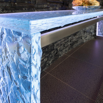 Glass table with LED lights in luxurious residential condo