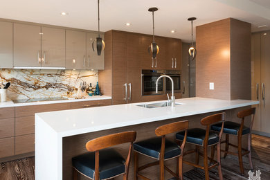 Large trendy single-wall medium tone wood floor eat-in kitchen photo in Toronto with a double-bowl sink, flat-panel cabinets, light wood cabinets, marble countertops, multicolored backsplash, stone slab backsplash, stainless steel appliances and an island