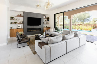 Large trendy open concept porcelain tile and gray floor living room photo in Phoenix with white walls, a ribbon fireplace, a tile fireplace and a wall-mounted tv