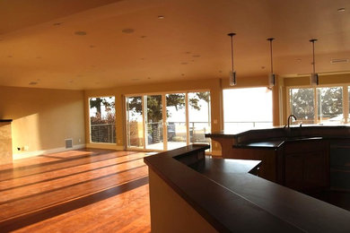 Example of a large transitional formal and open concept dark wood floor and brown floor living room design in Other with a standard fireplace, a tile fireplace and beige walls