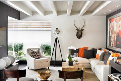 Family room - contemporary enclosed family room idea in Atlanta with gray walls