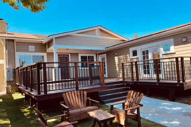 Deck - mid-sized craftsman courtyard ground level wood railing deck idea in San Diego