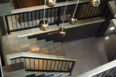 Huge trendy wooden straight open staircase photo in Denver
