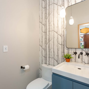 Bold Chicago Powder Room with Floating Vanity, Marble-Inspired Wall Tile & Wall-
