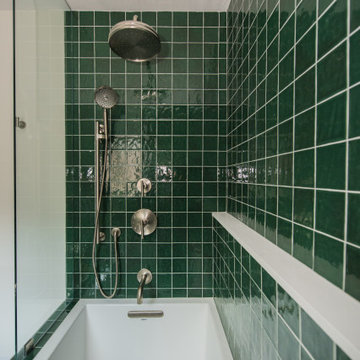 Vibrant Green Ceramic Tiles Bring Life to a Hallway Bathroom