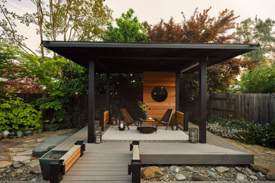 Large zen backyard deck photo in Sacramento