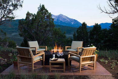 Patio - contemporary concrete patio idea in Denver with a fire pit and no cover