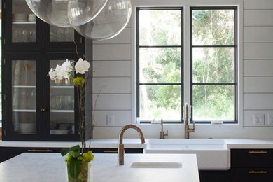 Inspiration for a large industrial u-shaped light wood floor and beige floor open concept kitchen remodel in Jacksonville with a farmhouse sink, shaker cabinets, blue cabinets, copper countertops, white backsplash, ceramic backsplash, stainless steel appliances and an island