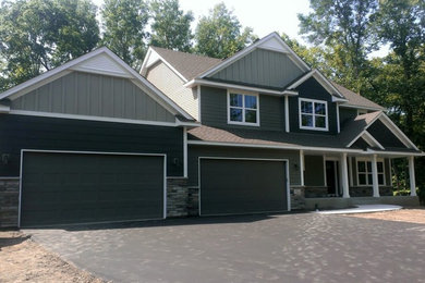 Contemporary gray two-story mixed siding exterior home idea in Minneapolis
