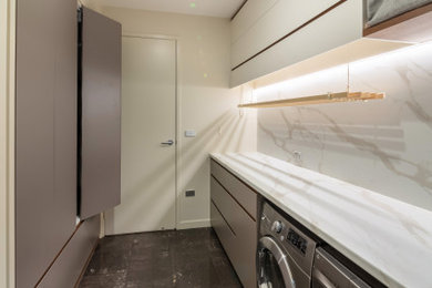 This is an example of a contemporary laundry room in Canberra - Queanbeyan.