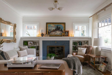 Example of a mid-sized transitional formal and enclosed medium tone wood floor and brown floor living room design in Portland with white walls, a standard fireplace, a tile fireplace and no tv