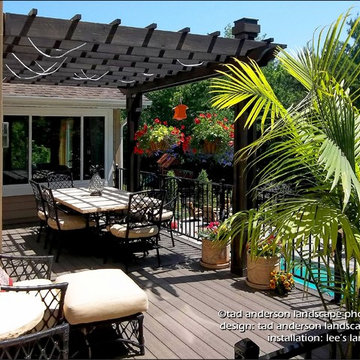 Pergola-Shaded Dining Deck Overlooks a Backyard Pool. Minnesota Deck Design