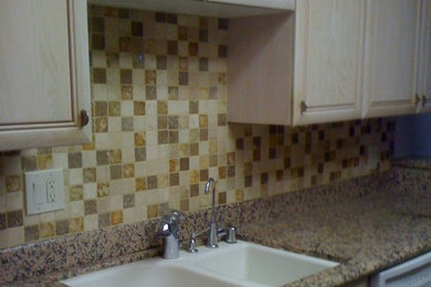 Inspiration for a mid-sized modern single-wall eat-in kitchen remodel in Los Angeles with marble countertops