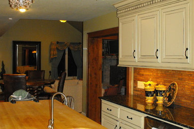 Kitchen - small traditional u-shaped kitchen idea in Other