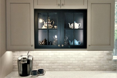 Eat-in kitchen - mid-sized contemporary l-shaped porcelain tile and gray floor eat-in kitchen idea in Houston with a farmhouse sink, shaker cabinets, blue cabinets, quartz countertops, gray backsplash, porcelain backsplash, stainless steel appliances and an island