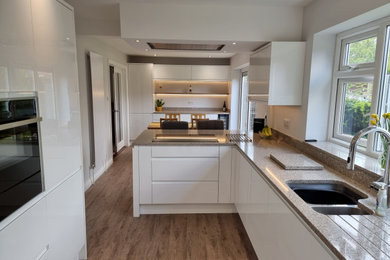 Photo of a large contemporary kitchen in Hampshire.
