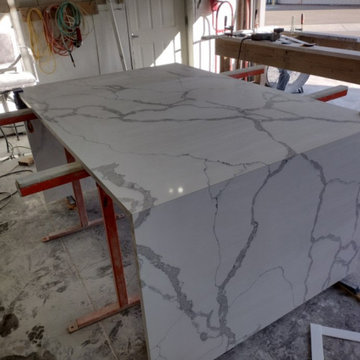 Double Waterfall Quartz island with Black Granite Perimeter