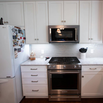 White Shaker Kitchen w/ Pietra Quartz Countertop and Gray Subway Tile Backsplash