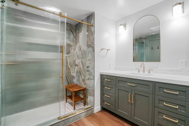 Mid-sized master white tile and porcelain tile laminate floor and single-sink bathroom photo in Los Angeles with shaker cabinets, green cabinets, green walls, an undermount sink, quartz countertops, white countertops and a built-in vanity