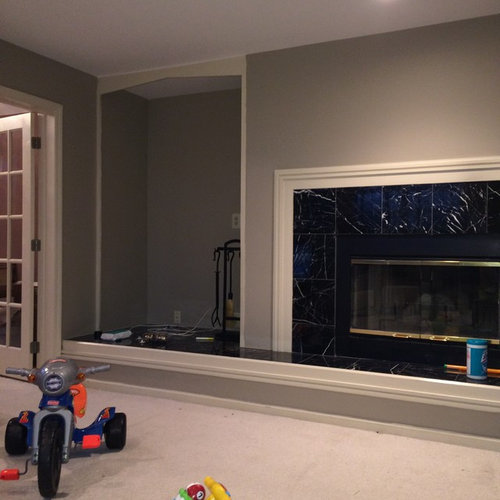 Empty space next to fireplace . Shelves ?