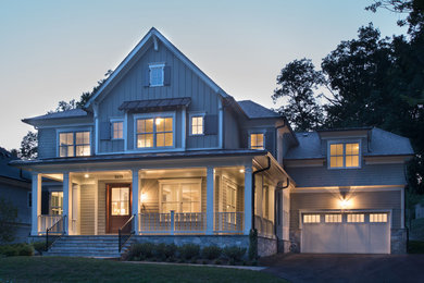 Mid-sized transitional two-story wood exterior home photo in DC Metro with a shingle roof