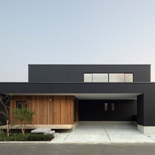 他の地域のモダンスタイルのおしゃれな家の外観 (黒い外壁、片流れ屋根、戸建、金属屋根) の写真