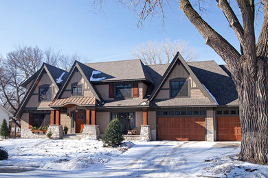 Huge elegant brown three-story wood gable roof photo in Minneapolis