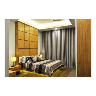 Ispirazione per una grande camera matrimoniale etnica con pareti beige e pavimento in gres porcellanato