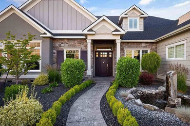 Example of a gray one-story exterior home design in Seattle with a shingle roof