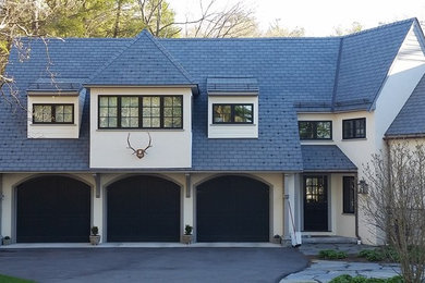 Huge elegant attached three-car garage workshop photo in Boston