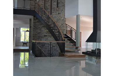This is an example of a contemporary hallway in Other with concrete floors.