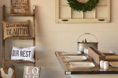 Dining room - large farmhouse concrete floor dining room idea in Austin with white walls