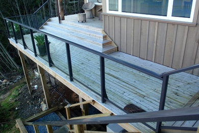 Inspiration for a large craftsman backyard dock remodel in Vancouver with no cover