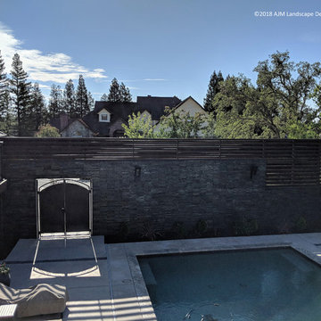 Transformation: Wall - ledgestone veneer with modern horizontal slats, and metal