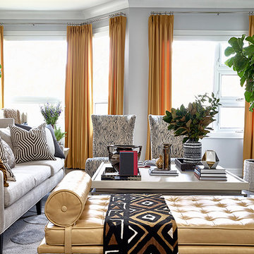 Gray Family Room With Beautiful Orange Drapery