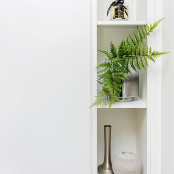 A Monochrome Bedroom With Fitted Furniture