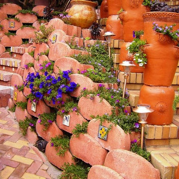 Front Yard with Artistic Driveway, Custom Sculptures, Planted Walls
