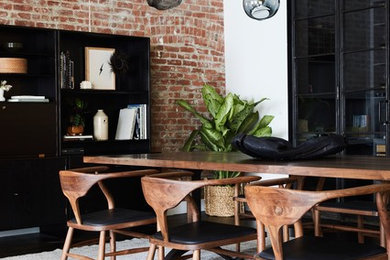 Scandinavian open plan dining room in New York with red walls, dark hardwood flooring and no fireplace.