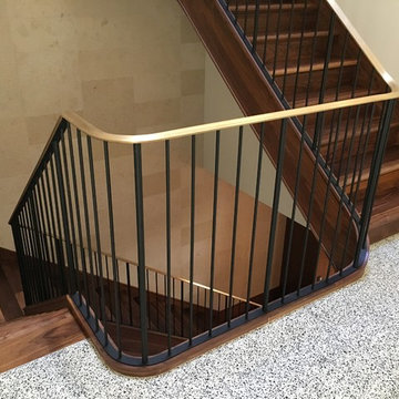 Walnut Stairs with Bronze Handrail and Iron Balusters