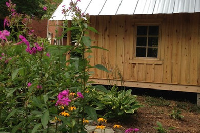 Inspiration for a mid-sized timeless detached garden shed remodel in Charlotte