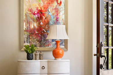 Example of a large transitional dark wood floor entryway design in Birmingham with beige walls and a dark wood front door