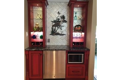 Inspiration for a mid-sized timeless open concept family room remodel in DC Metro with a bar
