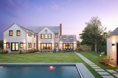 Coastal gray two-story exterior home idea in Boston with a shingle roof