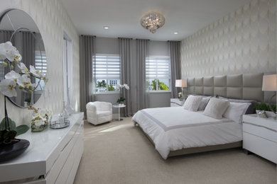 Bedroom - large modern master carpeted and beige floor bedroom idea in Miami with multicolored walls